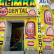 Somali dentist Hassan Ali, 35, sits inside his dental clinic with murals painted on the walls in Hamarweyne district of Mogadishu, Somalia.